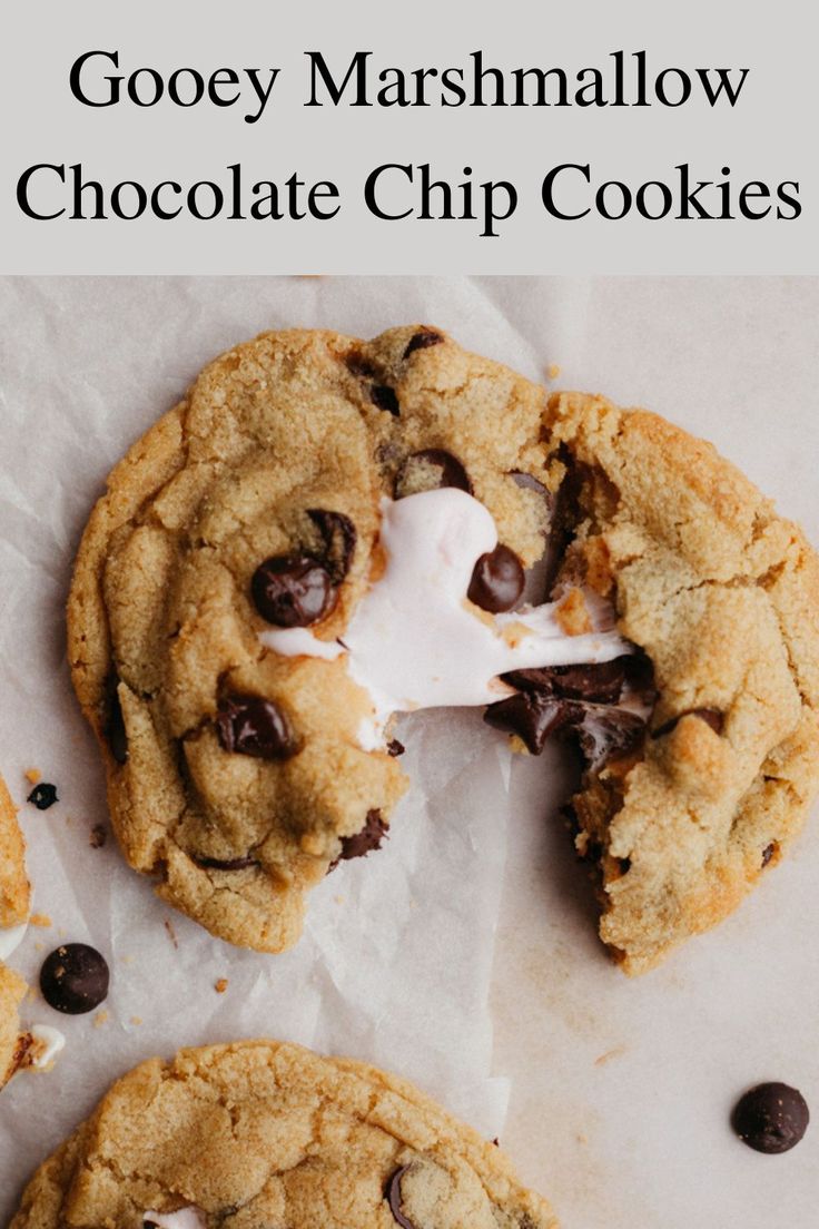 gooey marshmallow chocolate chip cookies on parchment paper with text overlay that reads gooey marshmallow chocolate chip cookies