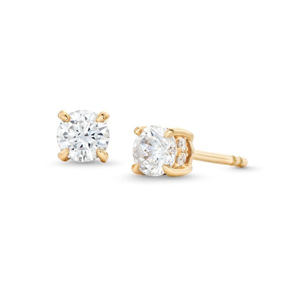 Light up your look with the timeless sparkle of these certified round diamond solitaire stud earrings in 14K gold. Crafted in 14K gold Each earring showcases a 1/4 ct. certified round diamond boasting a color rank of I and clarity of I1. A ribbon of diamonds wraps the center in a hidden halo design. Captivating with 5/8 ct. t.w. of diamonds Includes certification card These post earrings secure comfortably with friction backs. 14k Yellow Gold Solitaire Earrings, Gold Solitaire Diamond Earrings For Anniversary, Gold Solitaire Diamond Earrings Fine Jewelry, Gold Solitaire Diamond Earrings, Classic Yellow Gold Diamond Earrings, Classic Yellow Gold Clip-on Diamond Earrings, Classic 14k Gold Diamond Earrings With Prong Setting, Anniversary Solitaire Yellow Gold Diamond Earrings, Classic Yellow Gold Diamond Earrings With Prong Setting