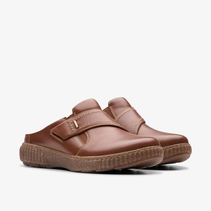 Womens Caroline Bay Tan Leather Mules | Clarks US Comfortable Slip-on Walking Shoes With Stitched Sole, Casual Leather Slip-on Sneakers For Walking, Slip-on Sneakers With Stitched Sole And Round Toe, Classic Slip-on Clogs With Textured Sole, Casual Leather Slip-ons With Textured Sole, Casual Slip-on Sneakers With Stitched Sole And Round Toe, Outdoor Slip-on Sneakers With Cushioned Footbed, Functional Synthetic Slip-ons With Round Toe, Casual Leather Closed Toe Slip-on Sneakers