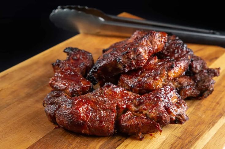 some meat is sitting on a cutting board