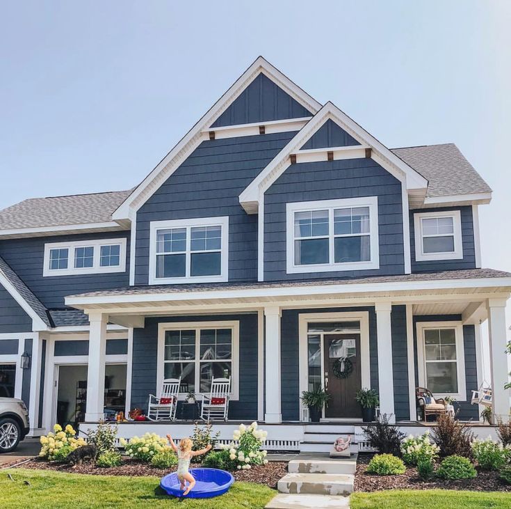 a house with blue siding and white trim