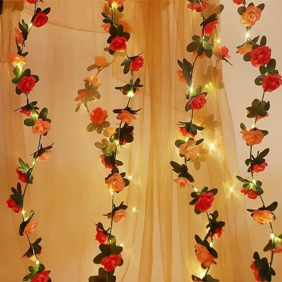 the curtain is decorated with flowers and fairy lights