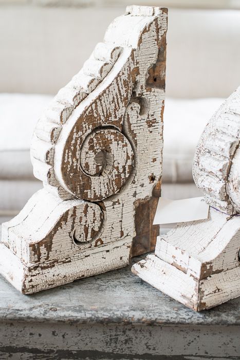 two white wooden objects sitting on top of a table