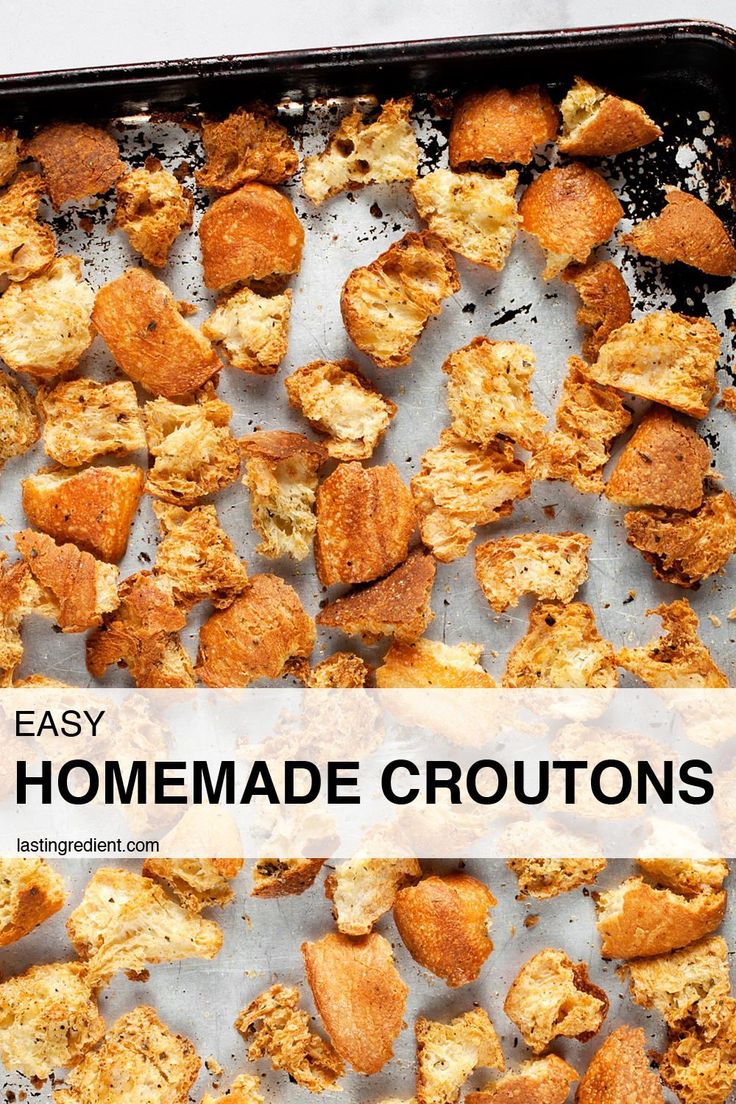 homemade croutons on a baking sheet with the words easy homemade croutons