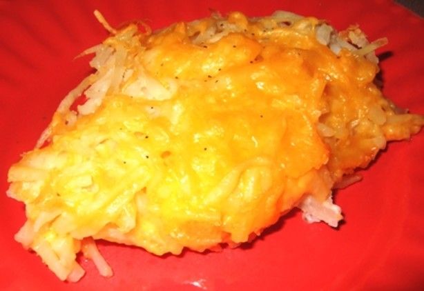 a red plate topped with macaroni and cheese