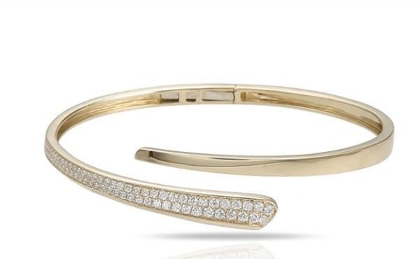 18k yellow gold diamond bangle bracelet with round brilliant cut diamonds weighing .76 carats total of F color, VS2 clarity. This item is currently out of stock. Please allow 4-6 weeks for delivery. Please note this item is a special order and non-refundable. Hand Set Diamond Cuff Bracelet In Yellow Gold, Yellow Gold Cubic Zirconia Cuff Bracelet, Yellow Gold Cubic Zirconia Diamond Bangle, Yellow Gold Diamond Bangle Bracelet With Accents, Yellow Gold Diamond Bangle With Brilliant Cut, 14k Gold Bangle Diamond Bracelet With Brilliant Cut, 14k Gold Brilliant Cut Diamond Bangle Bracelet, 14k Gold Bangle With Brilliant Cut Diamonds, Modern Yellow Gold Bangle With Brilliant Cut