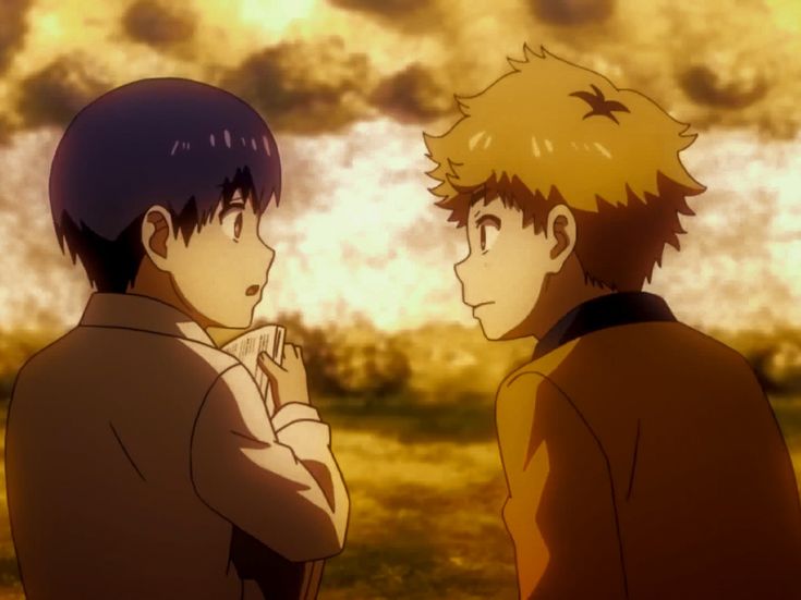 two young men standing next to each other in front of an orange and yellow sky