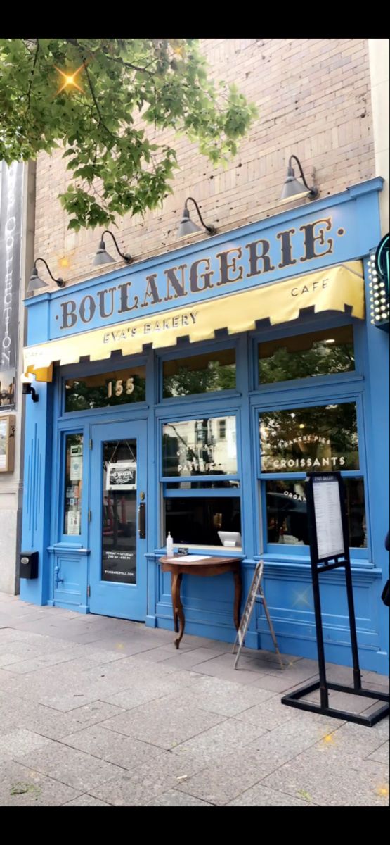 the outside of a restaurant with blue doors