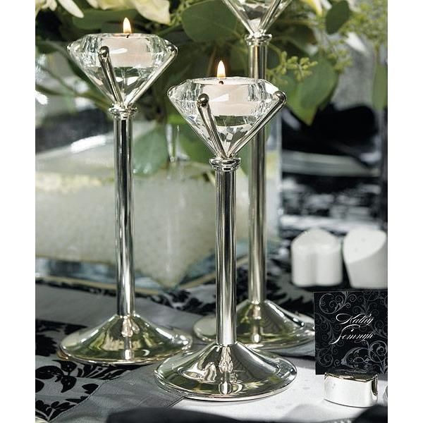 two martini glasses are sitting next to each other on a table with flowers in the background