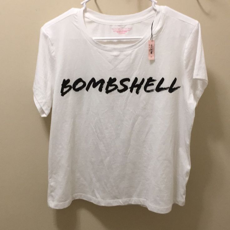 Nwt White With “Bombshell” Spelled Out On Front In Black Glitter. Super Soft Slightly Cropped Oversized Tee. Victoria's Secret Crew Neck T-shirt, Victoria's Secret Cotton T-shirt For Summer, Victoria's Secret Crew Neck T-shirt For Summer, Victoria's Secret Summer Tops With Short Sleeves, Victoria's Secret Short Sleeve Summer Tops, Victoria's Secret Casual Summer Tops, Victoria's Secret Casual Short Sleeve Top, Casual Short Sleeve Tops By Victoria's Secret, Trendy Victoria's Secret Crew Neck Top