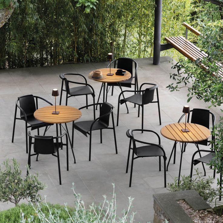 several tables and chairs are arranged on the patio