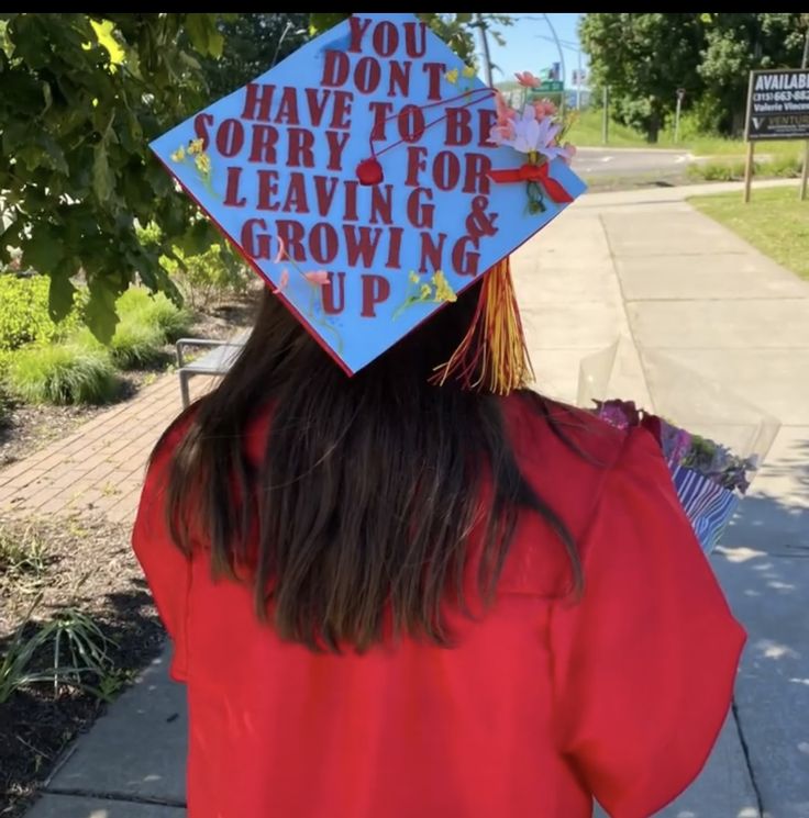 a person wearing a graduation cap that says you don't have to be sorry for leaving and growing up