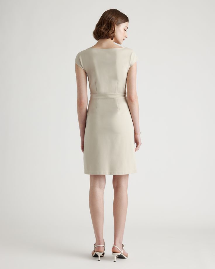 Ready to go for work or date night, this simple-yet-elegant cap sleeve dress is part of our best-selling ponte collection. You’ll feel like a boss thanks to the smooth, streamlined fit of our thick, stretchy knit fabric that’s as comfortable as it is alluring. And it looks great dressed up or down.  | Quince | Women's Ultra-Stretch Ponte Cap Sleeve Dress in Ecru, Size XS, Rayon Sleek H-line Workwear Dresses, Classic Knee-length Bodycon Dress For Work, Sleek Elastane Office Dress, Sleek Office Dresses, Elastane Dress For Workwear, Elegant Elastane Bodycon Dress For Work, Tailored Sleek Business Dress, Solid Elastane Workwear Dresses, Elegant Tailored Dresses For Business Casual