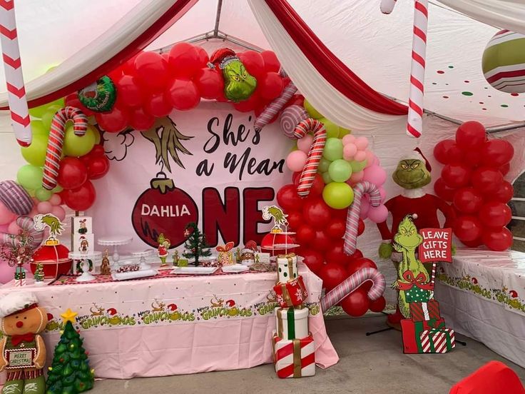 the dr seuss birthday party is set up with balloons and decorations