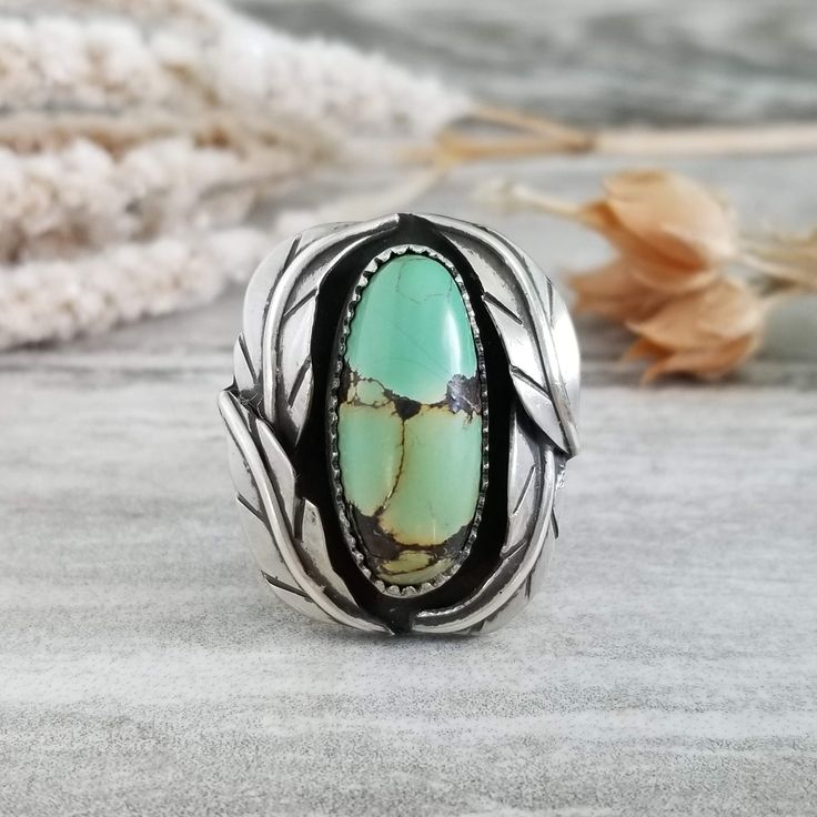 This beautiful ring features a southwestern design with a Lily Pond (also known as Bamboo Mountain) turquoise stone, silver feather adornments, and a split shank band for a powerful statement piece. This ring is a size 6; it cannot be resized. Turquoise is a strengthening stone, good for exhaustion, depression, or panic attacks. It enhances physical and psychic immune systems, supporting the assimilation of nutrients, alleviating pollution and viral infections. Turquoise is a most efficient heal Jewlery Rings, Vintage Turquoise Ring, Southwestern Design, Ring Turquoise, Lily Pond, Silver Feather, Turquoise Rings, Western Jewelry, Boho Ring