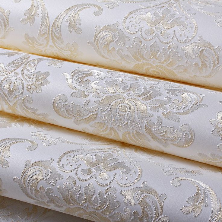 three white and gold wallpapers with intricate designs on them, all lined up together