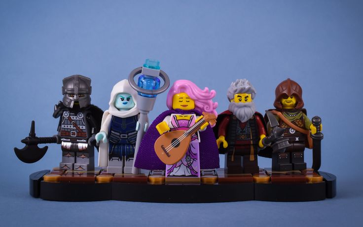 the legos are all lined up together to play guitar and sing with each other