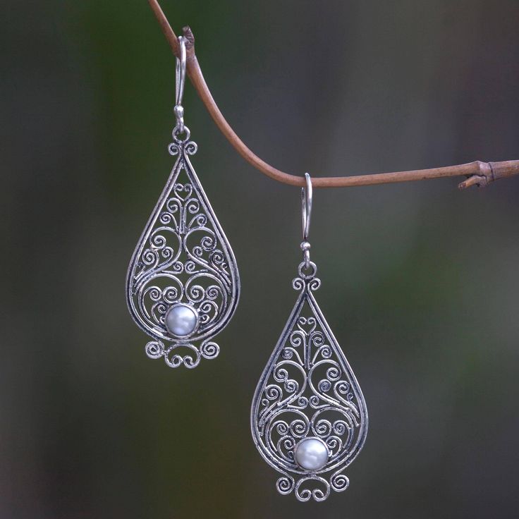 Shining tendrils form an intricate filigree lace. Crafted by hand these exquisite earrings from Komang Wijayana feature the glow of cultured pearls. White Intricate Design Drop Earrings, Ornate Teardrop Jewelry With Intricate Design, White Bohemian Earrings With Intricate Design, White Intricate Dangle Jewelry, Silver Pearl Drop Earrings With Intricate Design, Traditional Filigree Pearl Earrings For Gifts, Traditional Filigree Pearl Earrings As Gift, Ornate Pearl Earrings As Gift With Intricate Design, Silver Filigree Drop Pearl Earrings