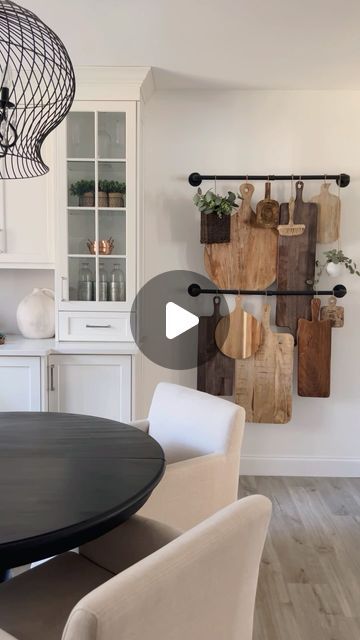 the kitchen is clean and ready to be used for dinner or lunch time, with cutting boards hanging on the wall