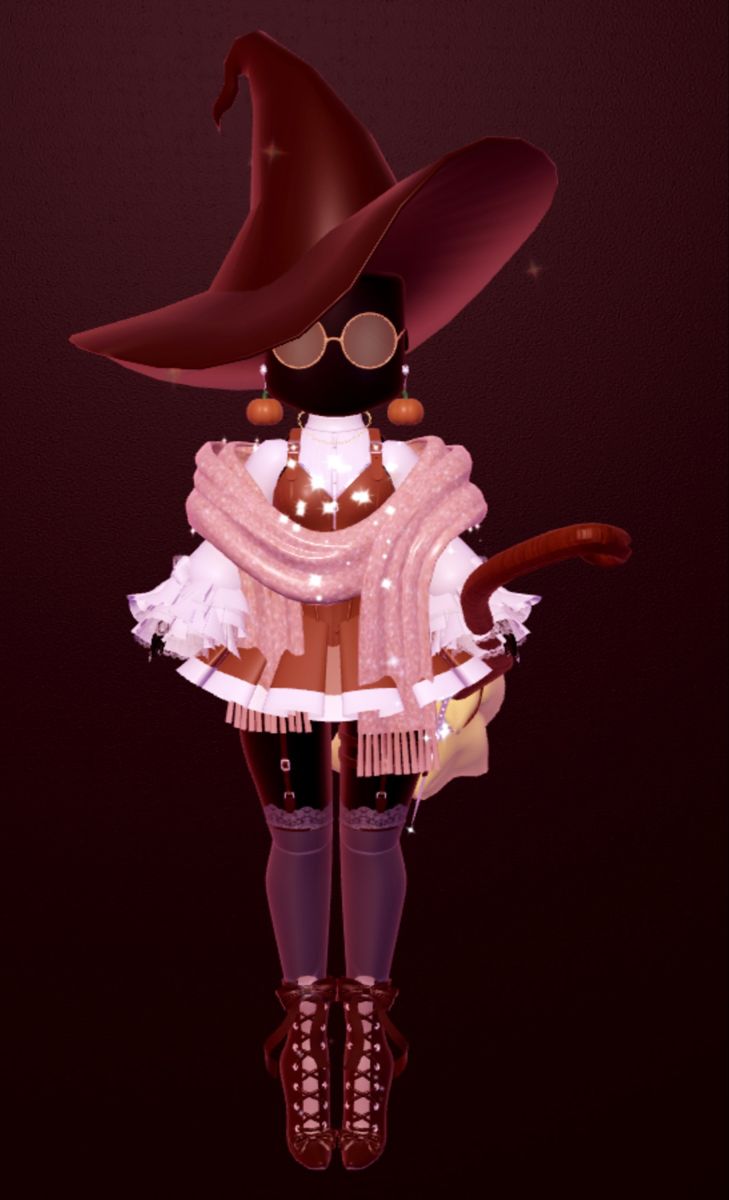 a woman in a witch costume with a hat and cane standing on a dark background