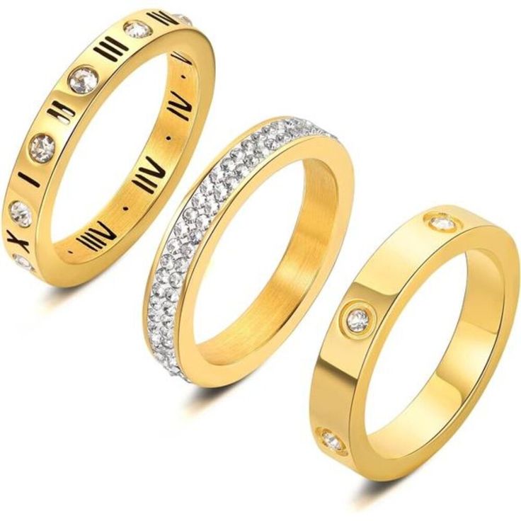 three gold rings with roman numerals and diamonds on the sides, set against a white background