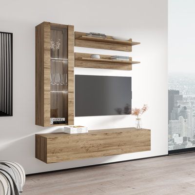 a living room with white walls and wooden entertainment center on the wall, in front of a cityscape