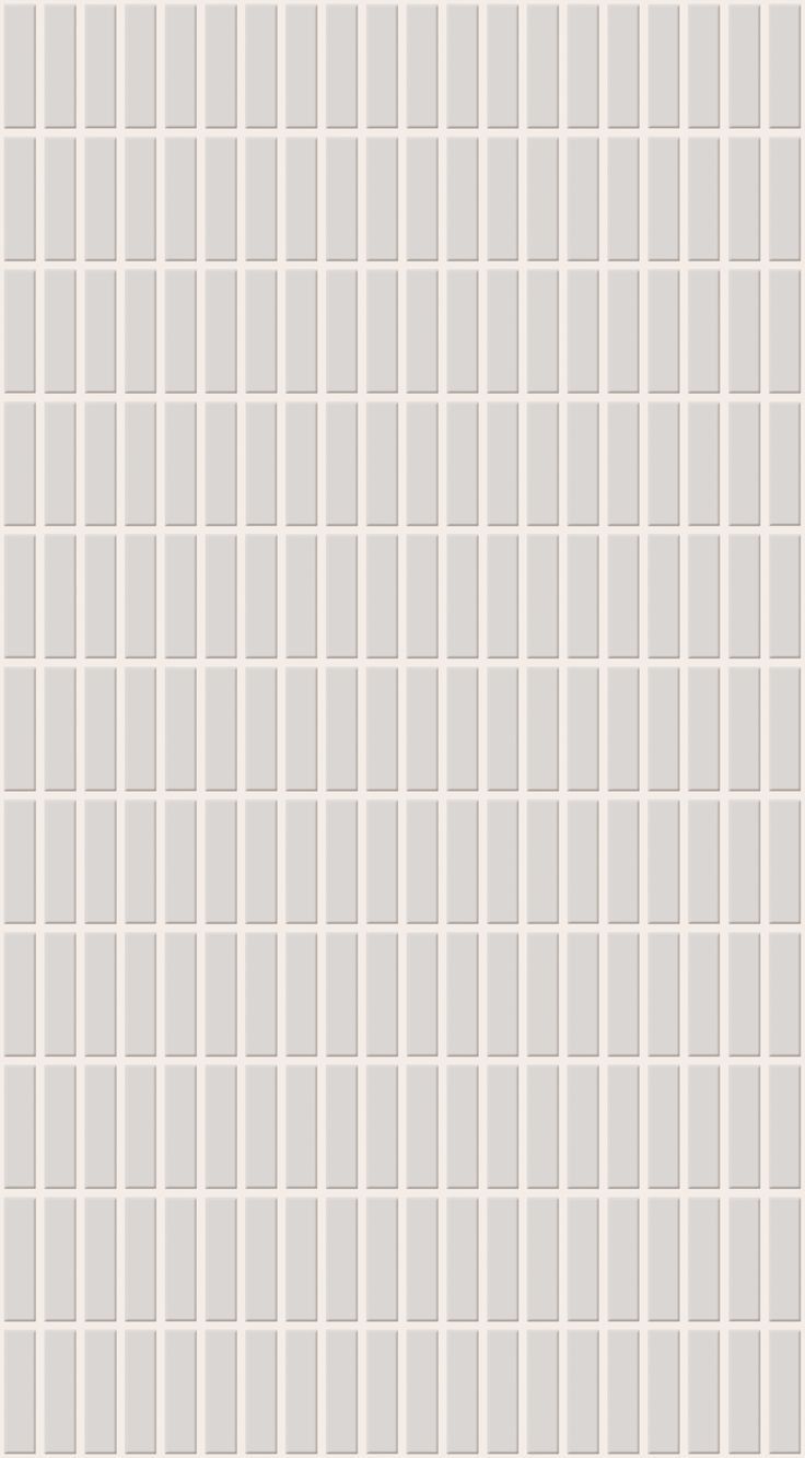 a white tiled wall with small squares on it