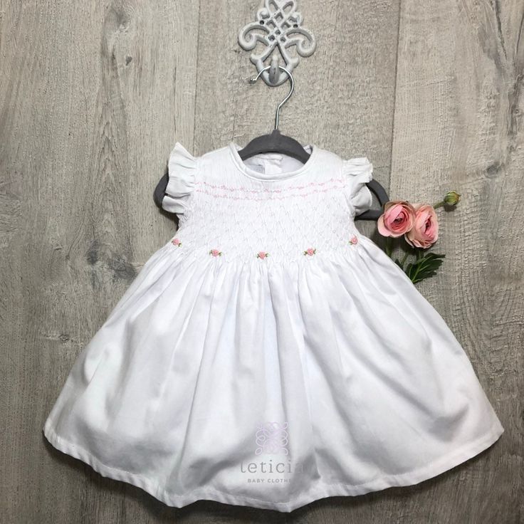 White Handsmocked dress in 100% Pique Cotton Fabric with hand embroidered pale pink flowers. Size 12m . Fully lined. Diaper cover included. Pale Pink Flowers, Hand Smock, Quality Dresses, Elastic Headbands, Diaper Cover, Baby Patterns, Color Rosa, Pale Pink, Hand Embroidered