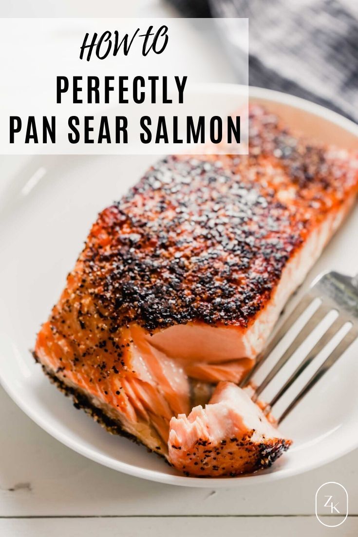 a piece of salmon on a white plate with a fork and text overlay that reads how to perfectly pan sea salmon