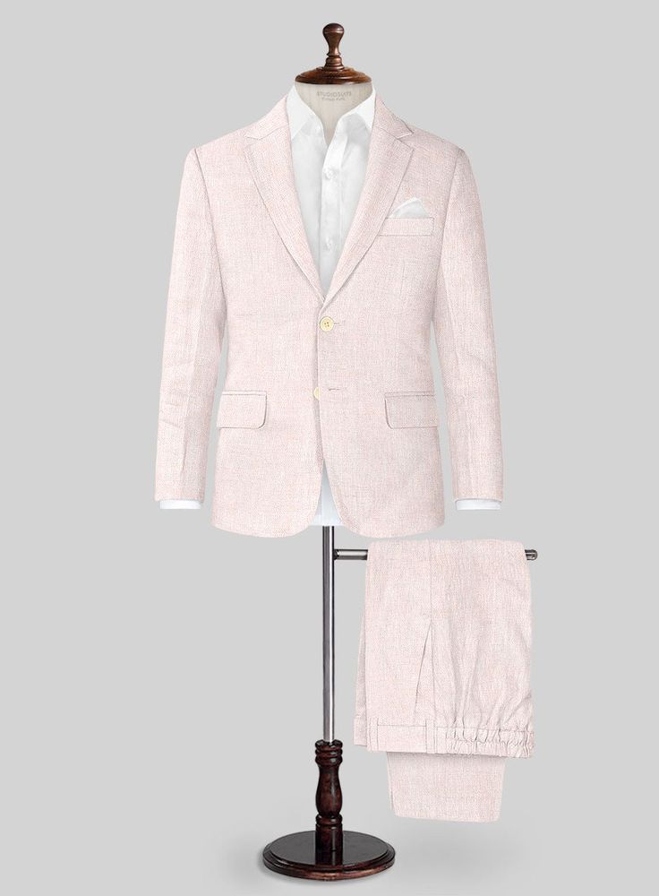 Get ready for summer fun with our Roman Light Pink Linen Boys Suit. Crafted from premium linen, this charming suit is perfect for boys and features a stylish two-button jacket that is both elegant and comfortable. Ideal for any formal event, this suit comes in a delightful light pink color that adds a touch of sophistication. Whether it's a beach wedding, dinner party, or a day out on a yacht, this suit ensures your little one looks his best while feeling great.  Look Includes    Roman     Light     Pink     Linen  Fabric  Two Button Jacket Style  Notch Lapel    Corozo   Beige  Buttons  Single Vent  Three Cuff Buttons  Two Welted Back Pockets on Trousers    Click 'Customize Now' to modify the look if needed.   Lining: Viscose; Dry Clean. Semi-formal Summer Sets With Notch Lapel, Classic Summer Sets With Notch Lapel, Summer Single-breasted Sets With Notch Lapel, Tailored Summer Suits With Welt Pockets, Summer Business Single-breasted Suit Set, Summer Suit With Single Button And Notch Lapel, Summer Suit With Single Button And Suit Collar, Classic Pink Summer Blazer, Classic Summer Three-piece Suit For Formal Occasions