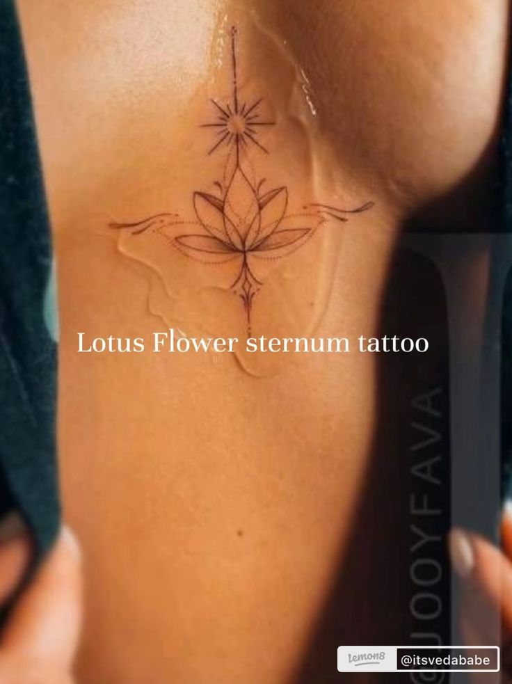 a woman with a flower tattoo on her chest and the words lotus flower sternum tattoo