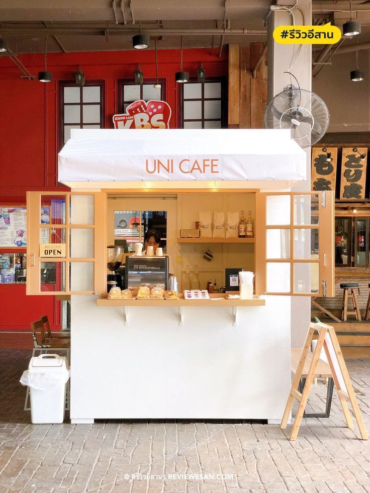 a food stand that is in the middle of a building