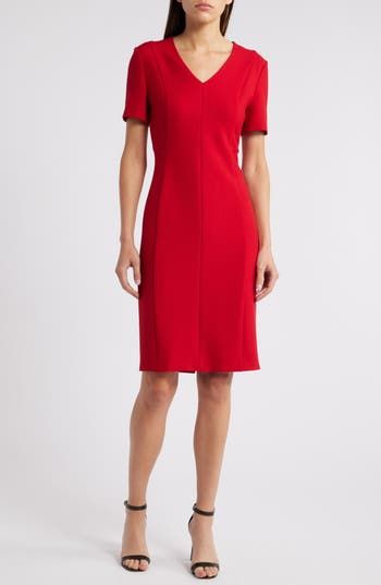 Make a bold entrance wherever you go in this sophisticated sheath dress made with a touch of stretch. 39" length Back zip closure V-neck Short sleeves Partially lined 67% viscose. 29% polyester, 4% elastane Machine wash, line dry Made in Turkey Knee-length Seamed Workwear Dress, Seamed Knee-length Dress For Work, Seamed Fitted Midi Dress For Work, Fitted V-neck Midi Dress For Career, Elegant Fitted Seamed Dress, Sleek V-neck Elastane Dress, Formal Dresses With Straight Neckline In Elastane, Formal Dress With Straight Neckline In Elastane, Stretch Lined Dresses For Work