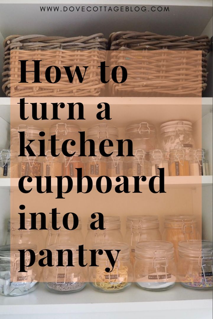 an open kitchen cupboard with jars and baskets on the shelves, text overlay reads how to turn a kitchen cupboard into a pantry