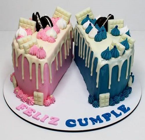 two cakes with icing on top of each other, one is blue and the other is pink