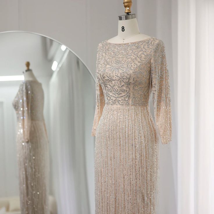 Elegant silver nude color palette adds glamour. Intricate beading and tassel detailing showcase opulence and style. Long sleeves offer coverage and elegance. Crafted with high-quality materials for comfort and durability. Perfect for weddings, parties, and special events in 2025 . Make a memorable entrance and enchant hearts with this stunning evening gown. Nude Evening Dresses, Dubai Evening, Arabic Women, Yellow Evening Dresses, Silver Evening Dress, Purple Evening Dress, Gold Evening Dresses, Evening Dress Long, Green Evening Dress