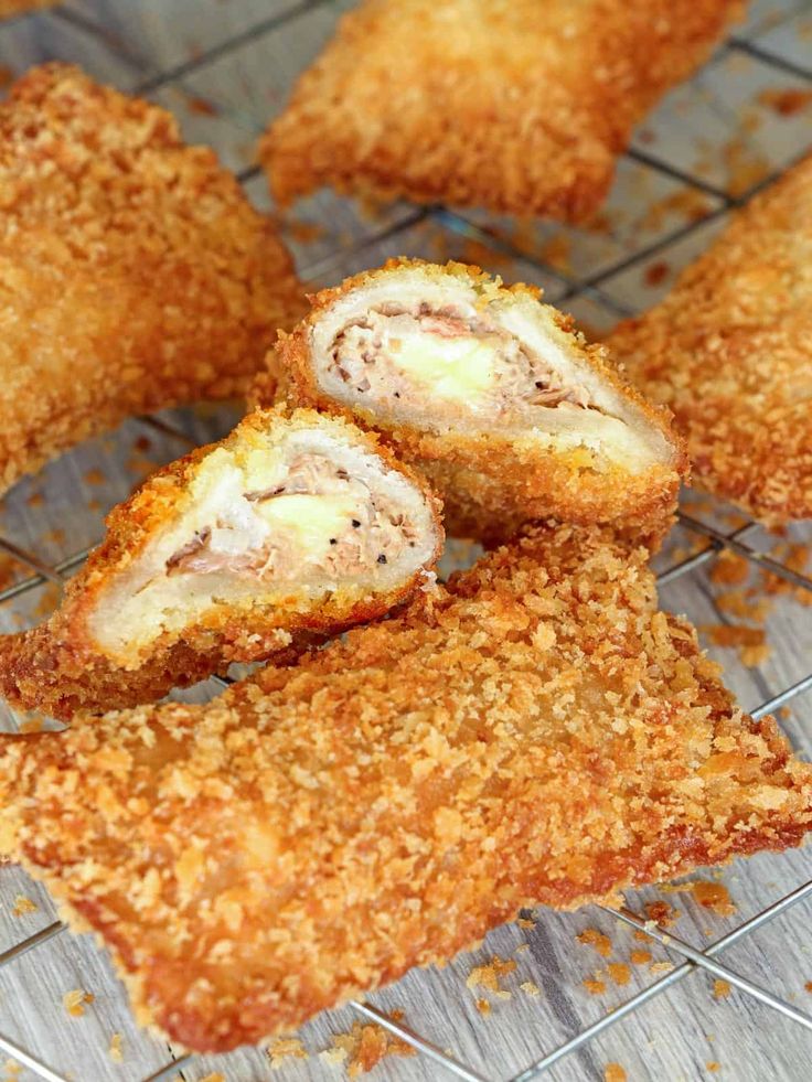 some food that is on a rack and has been cut in half to look like chicken nuggets