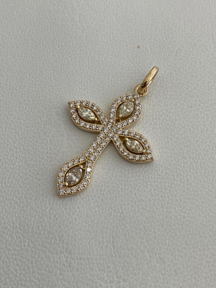 18 Karat stamped yellow gold handcrafted diamond crucifix pendant. Contains 4 marquise cut and 74 round brilliant cut diamonds weighing approximately by gauge 1.35 cts in total. Clarity: VS1-SI2 Color: F-G average Cut: Very Good/Excellent Total estimated gram weight: 4.90 grams  Pendant dimensions are 28mm by 36mm Pendant comes with jewelry box packaging as well as official jewelry appraisal. Luxury Fine Jewelry Cross Necklace As Gift, Luxury Fine Jewelry Diamond Cross Pendant Necklace, Luxury Yellow Gold Fine Jewelry Cross Necklace, Engraved Yellow Gold Cross Pendant, Cross-shaped Yellow Gold Diamond Necklace, Diamond-cut Cubic Zirconia Crucifix Necklace, Diamond-cut Crucifix Cross Necklace, Ladies Jewellery, Yellow Gold Diamond-cut Crucifix Necklace