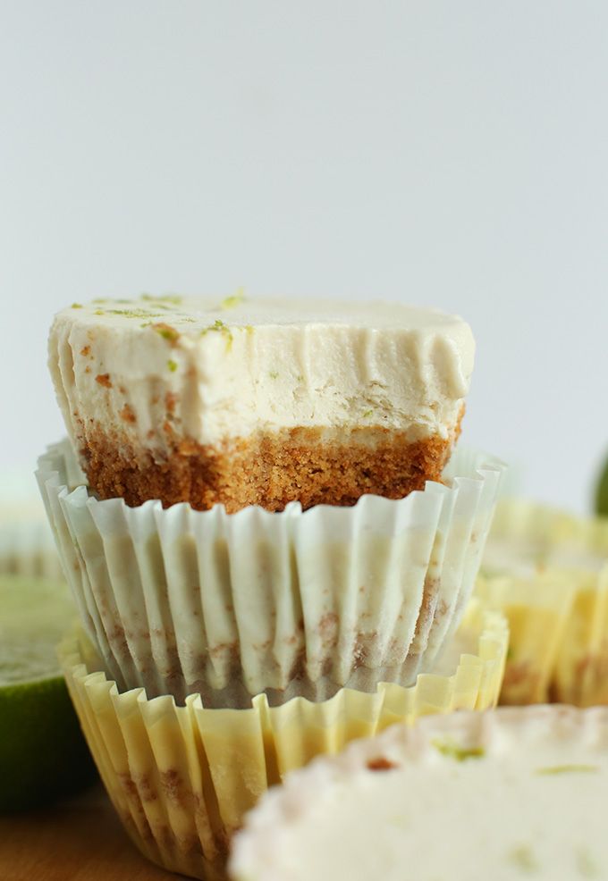 several cupcakes with frosting and lime slices