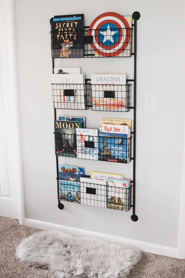 a bookshelf that has some baskets on it