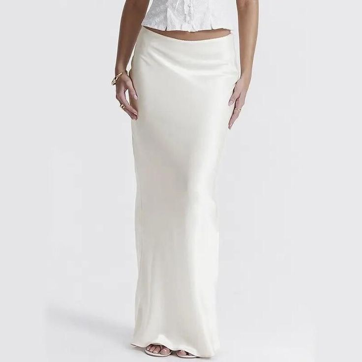 Discover Elegance and Comfort with Our High-Waist Satin Maxi Skirt Introducing the perfect blend of style and comfort - our High Waist Satin Maxi Skirt. Designed for the modern woman who loves to make a statement, this skirt is the epitome of elegance and sophistication. Whether you're heading to the office, a party, or a casual outing, this versatile piece is your go-to for any occasion. Key Features High-Quality Fabric: Made with a luxurious blend of polyester and silk, providing both durability and a silky-smooth feel. Flattering Fit: A slim-fit silhouette that hugs your curves in all the right places. Adjustable Lace-Up Design: For a customized and comfortable fit that flatters any body type. Timeless Style: The solid color and pencil silhouette make it a classic piece for any wardrobe Luxury Fitted White Pencil Skirt, Luxury Fitted Satin Maxi Skirt, Luxury Long Silk Pencil Skirt, Elegant Luxury White Pencil Skirt, Luxury Long Summer Pencil Skirt, Luxury Black Pencil Skirt For Office, Luxury Casual Pencil Skirt, Luxury Modern Long Pencil Skirt, Luxury High Waist White Skirt