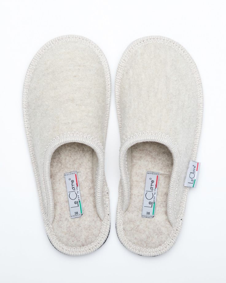 Description: The Le Clare women's Stella in beige is the classic "hotel slipper" reimagined in luxurious boiled wool. This quintessential slipper provides delicate comfort and has been handcrafted, only for the most discerning, the Stella will not disappoint. Featuring our premium Italian boiled wool fiber, the slipper gently conforms to your foot for cozy comfort. The natural elasticity of our wool bounces back to its original shape, giving the slipper lasting appeal with a customized fit. This Classic Closed Toe Winter Slippers, Classic Indoor Slippers With Cushioned Footbed, Classic Slip-on Indoor Slippers, Soft Beige Slip-on Slippers, Classic Winter Slippers With Rubber Sole, Beige Closed Toe Slippers With Soft Sole, Cream Round Toe Indoor Slippers, Cream Slip-on Slippers With Cushioned Footbed, Beige Cushioned Slippers For Indoor Use