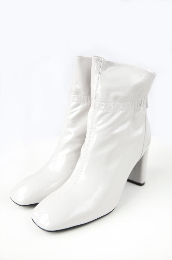 patent leather boots with back zipper. White Winter Platform Boots With Zipper, White Platform Boots With Zipper For Winter, White Fitted Ankle Boots, Fitted White Ankle Boots, White Leather Fitted Mid-calf Boots, Fitted White Leather Mid-calf Boots, White Faux Leather Heeled Boots For Winter, White Formal Boots For Winter, White Formal Winter Boots