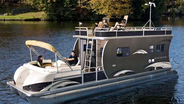 a small boat is traveling on the water with its driver in it's seat