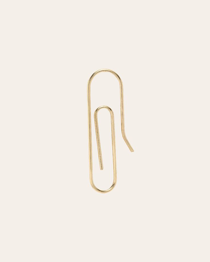 Modern and edgy 14k solid gold paper clip earring. It will be your new favorite ear accessory! Sold as a Single Size: Approx. 7mm(W) by 23mm(H) Total Weight: Approx. 0.5 grams Standard Production: 3-7 business days Rush Order Production: 2-5 business days Shipping: Select shipping method at checkout. Shipped from our L.A. Studio. This item is Final Sale. See here for details. Paper Clip Earring, Clip Earring, Gold Paper, Paper Clip, Clip On Earrings, Rush, Solid Gold, Unique Style, Jewelry Box