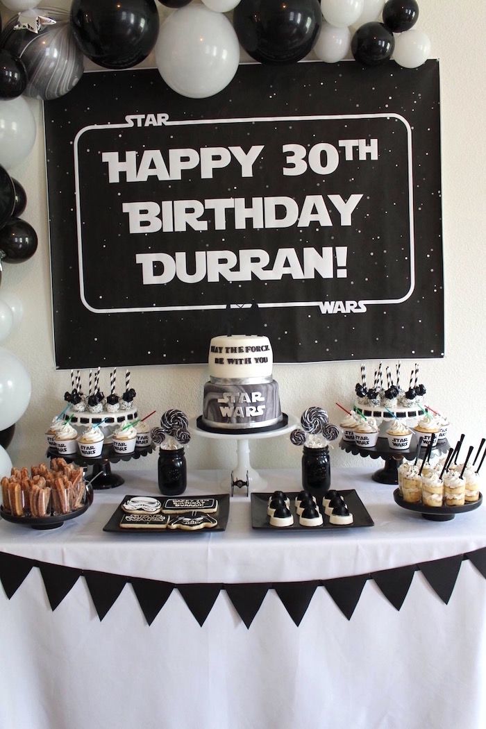 a star wars birthday party with black and white decorations