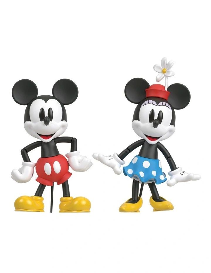 two mickey and minnie mouse figurines standing next to each other on a white background