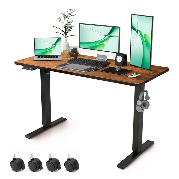 a computer desk with three monitors and a laptop on it, all connected to each other