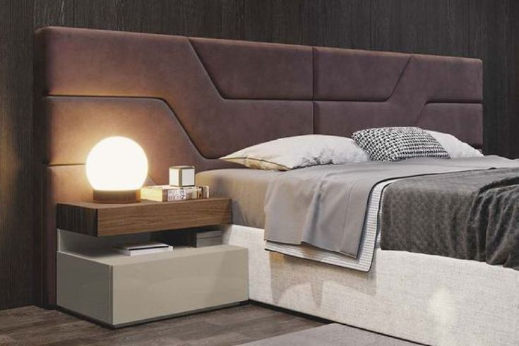 a bedroom with a bed, night stand and nightstands on the floor in front of it