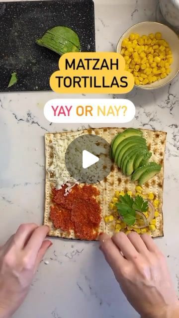 a person making tortillas with avocado, corn and salsa